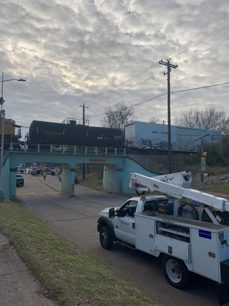 Crews are awaiting all clear from the train company to cross train tracks. 