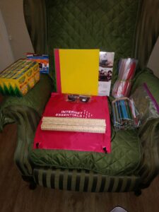 School supplies and Internet Essentials bag placed on green armchair