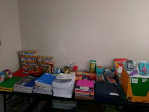 A table full of various school supplies