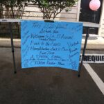 A blue sign taped to a table with positive writing and stating 2020-2021 School Year