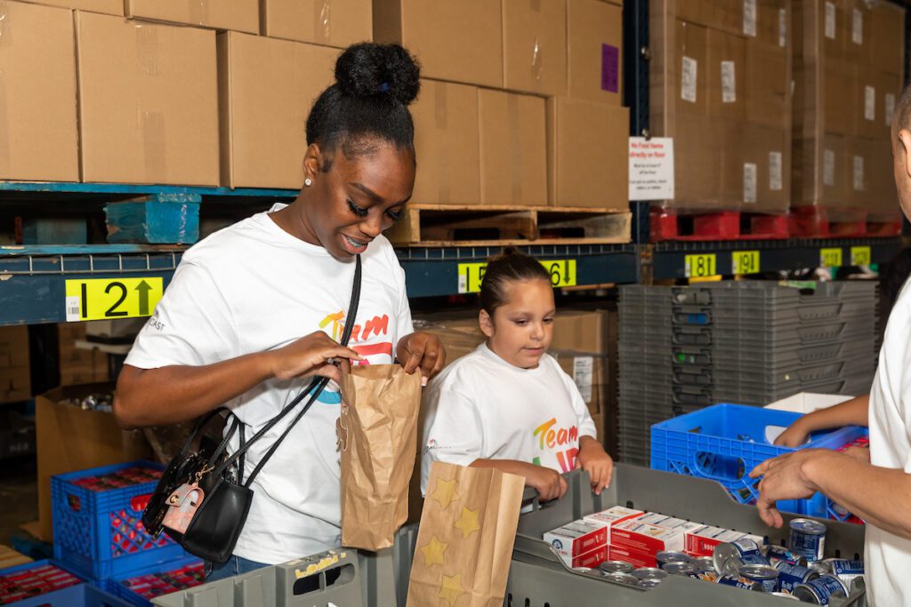 Woman and child looking in bags