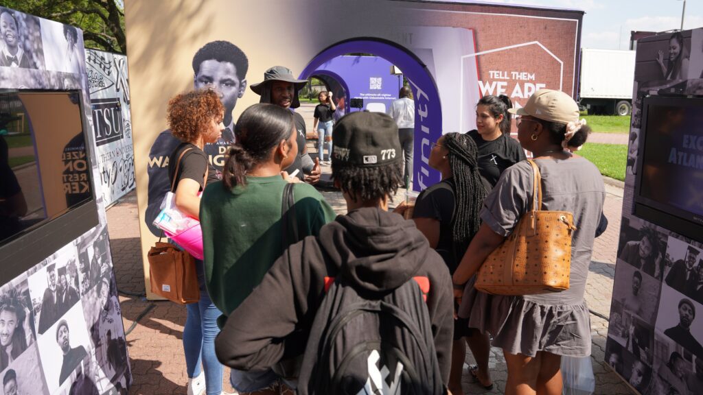 Group of students standing together in a discussion