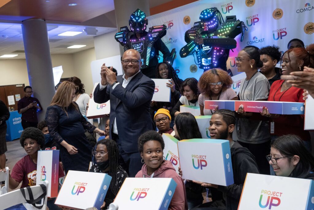 Clapping Broderick Johnson with Project Up recipients.