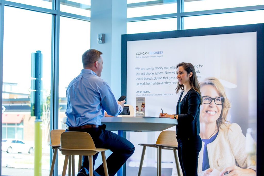 A potential customer visits with a Comcast Business representative.