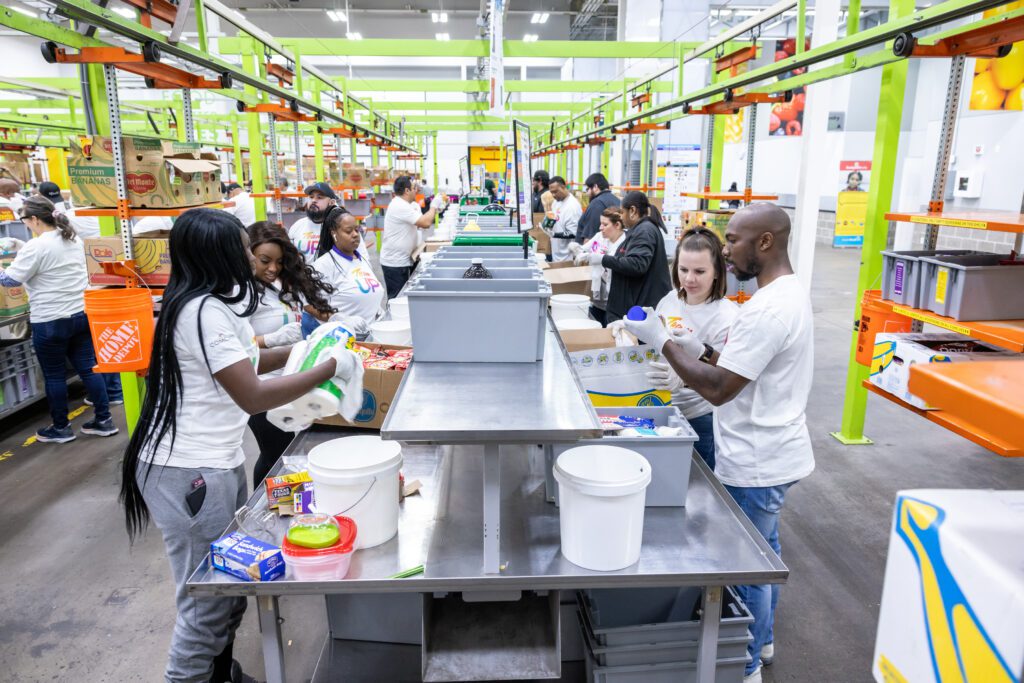 Team Up volunteers sorting at tables