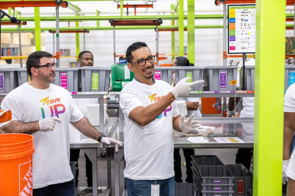 Two Team Up volunteers at food bank