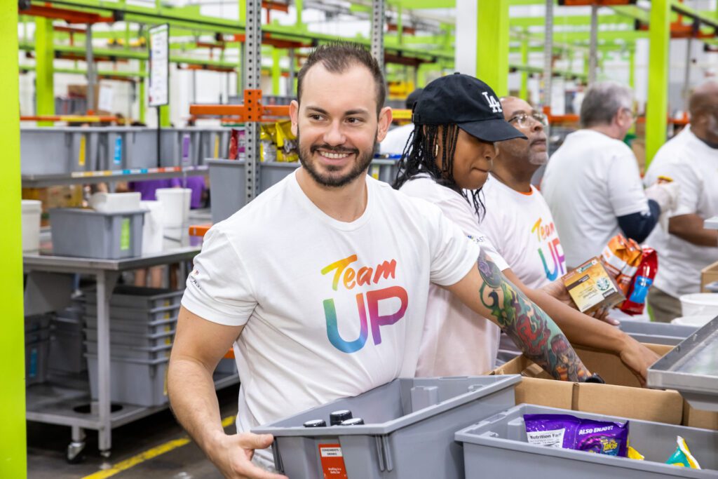 Team Up volunteer looking to his right and smiling.