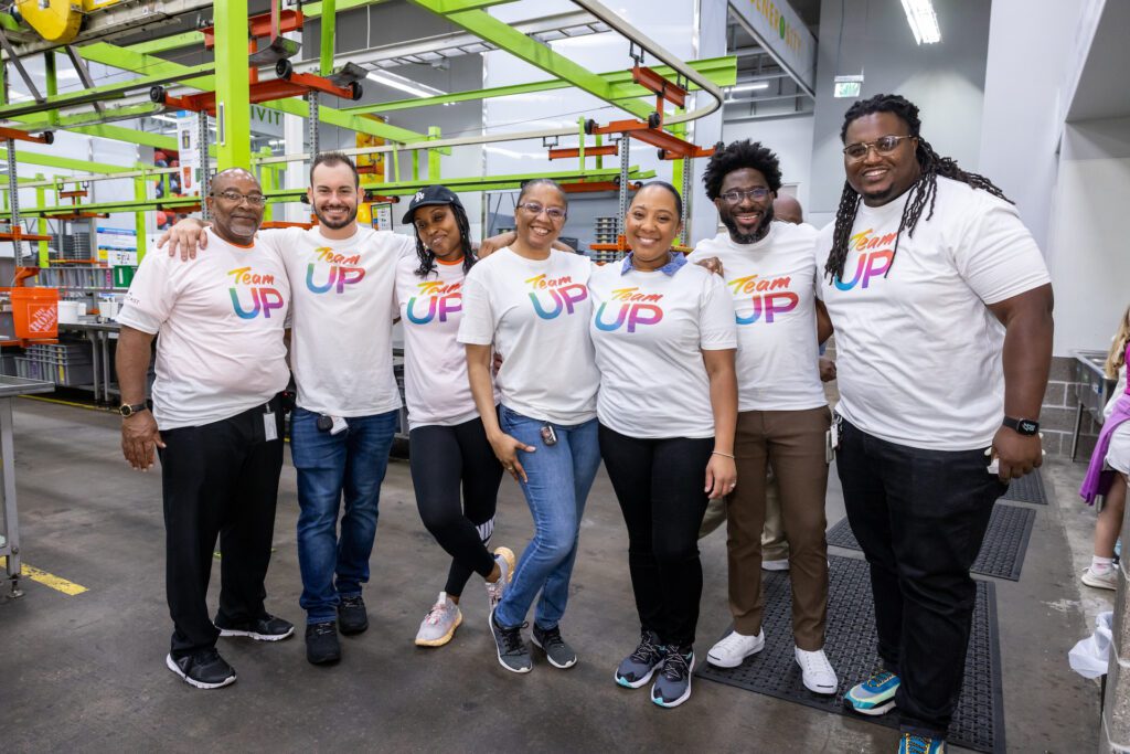 Team Up volunteers posing for a picture inside food bank