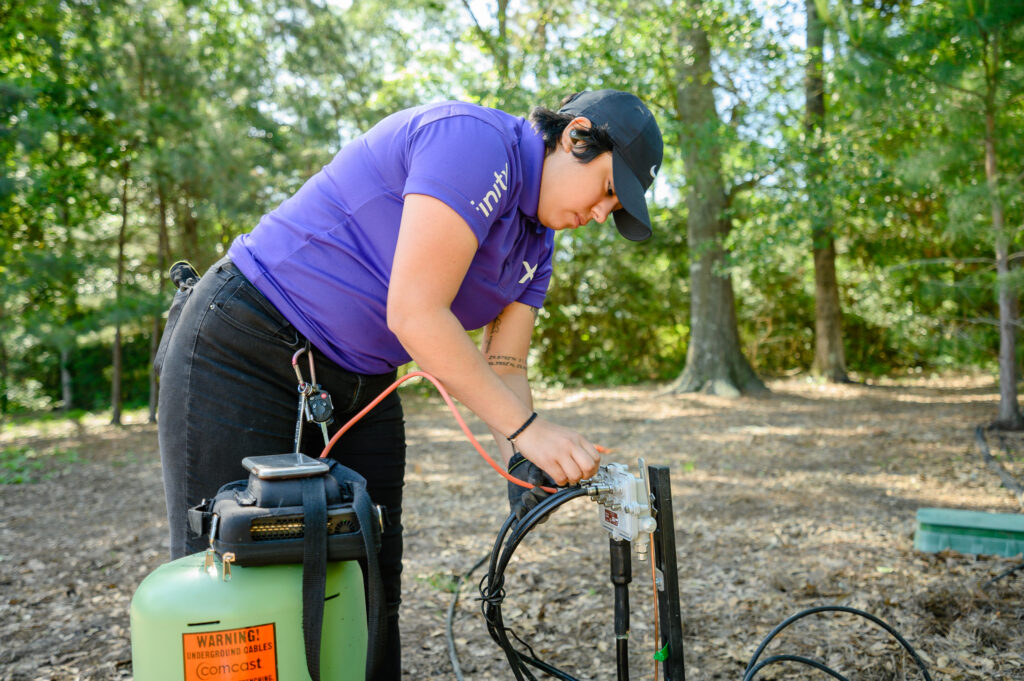 A technician outside working.