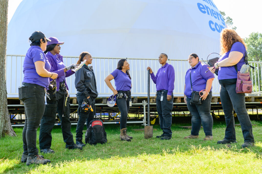 A group of women technicians gathered together