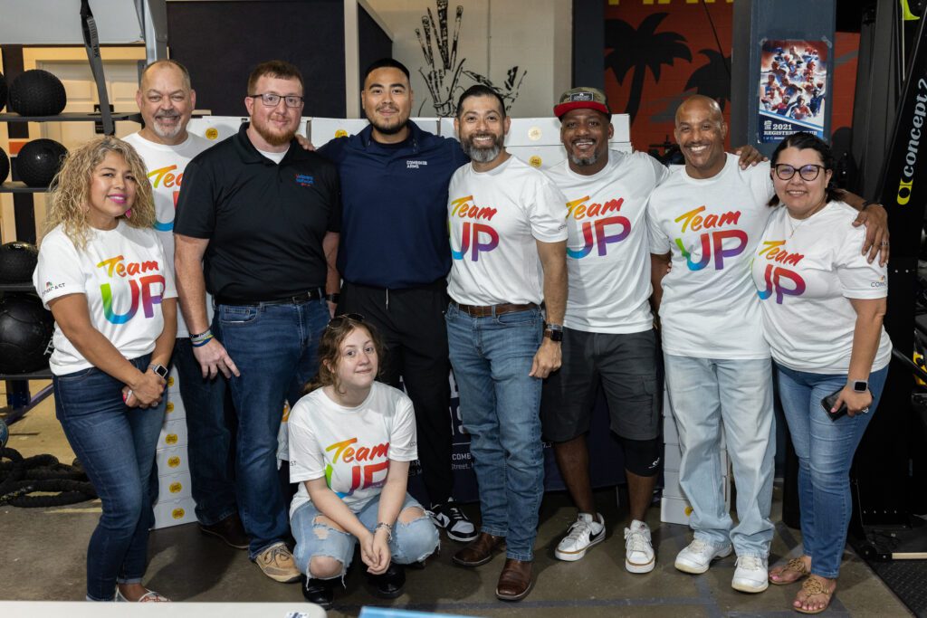 Group of people posing for picture together