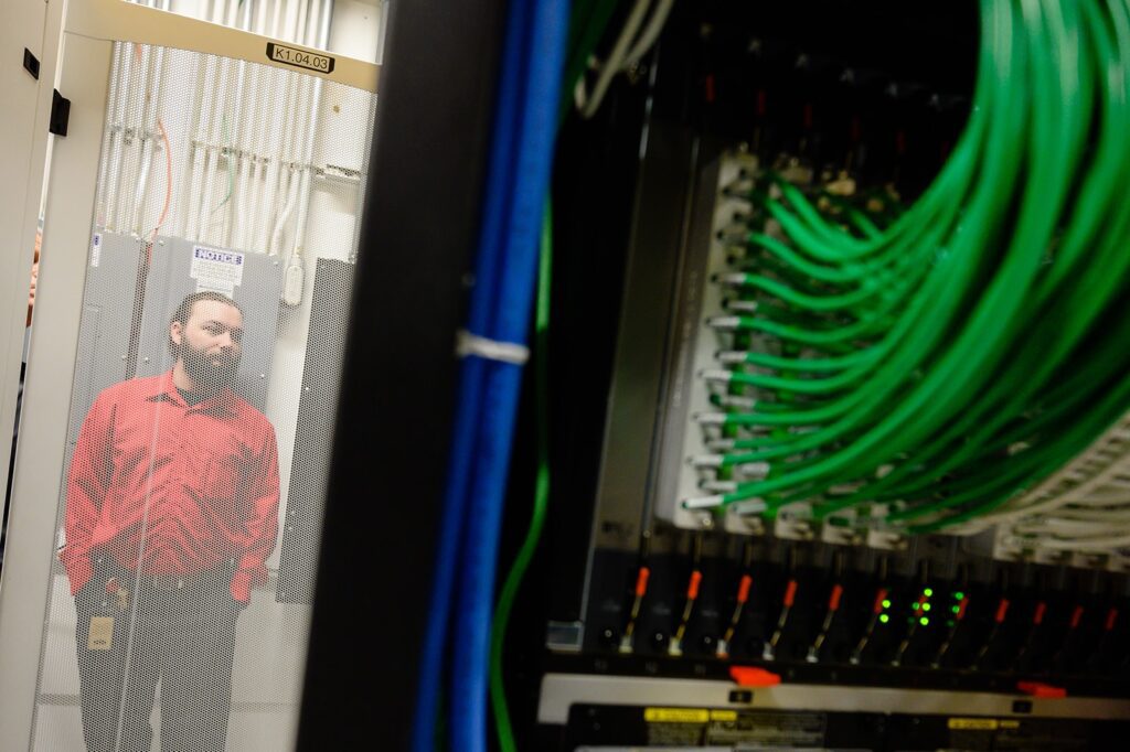 Gentleman standing adjacent to a server.