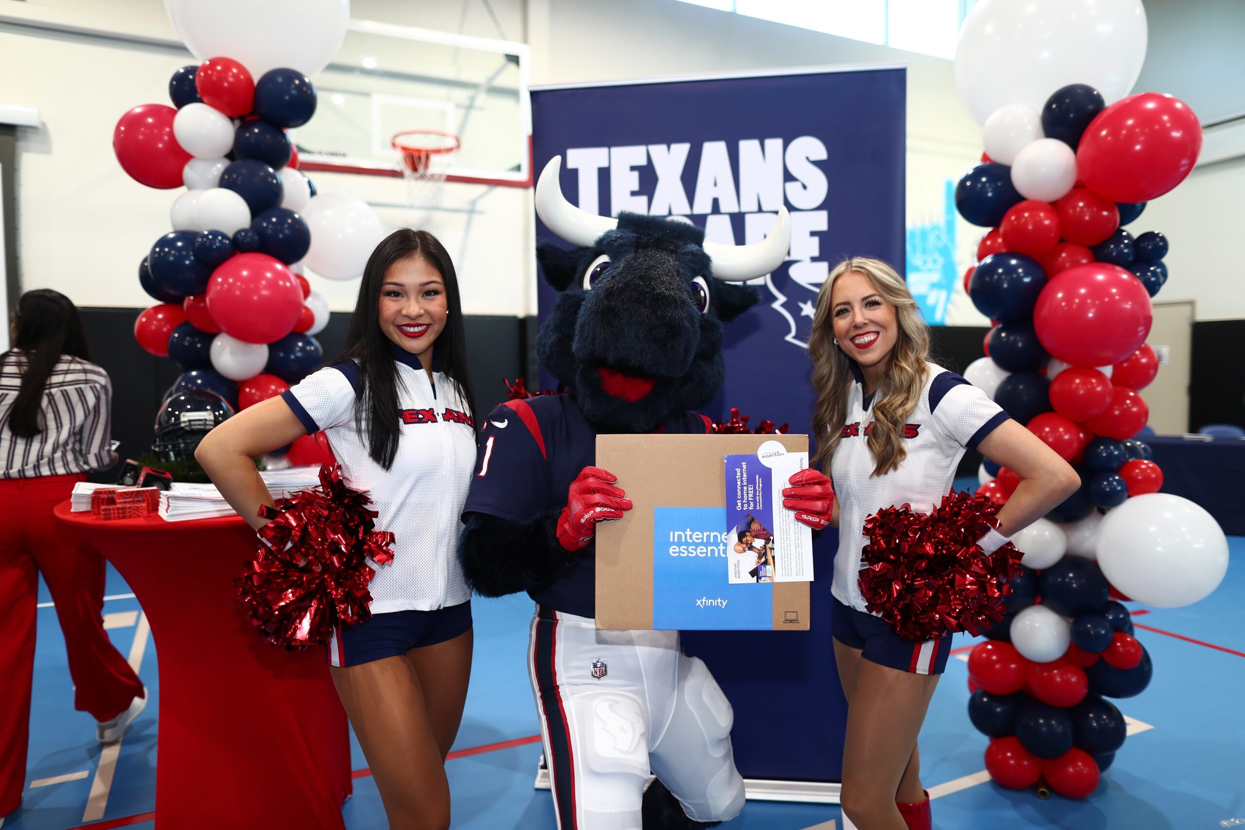 Mascot and cheerleaders posing for pictures during Digital Literacy Night event.