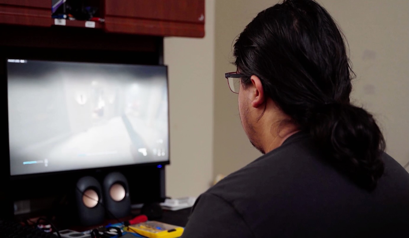 A young man plays a video game in Kingwood, Texas.