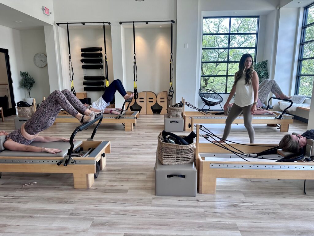 Women receiving pilates instruction