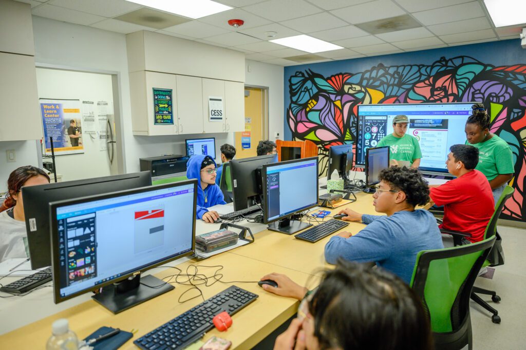 Students work inside AAMA's Work and Learn Center