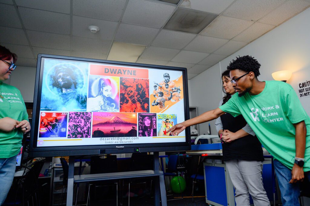 A student shows off his designs inside the Work and Learn Center.