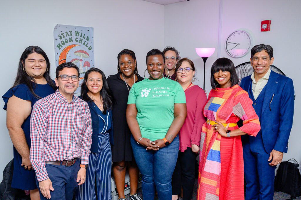 Attendees of the Work and Learn Center's Open House gather for a photo.