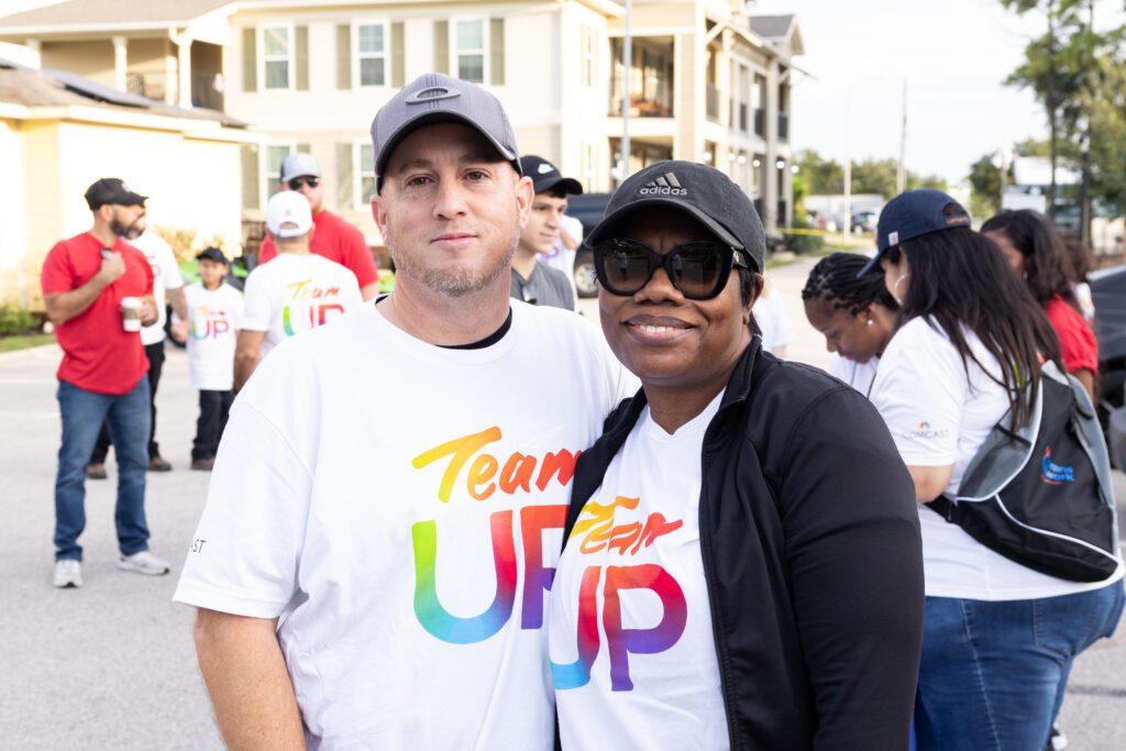 Volunteers smile for a photo at Camp Hope in Houston, Texas.