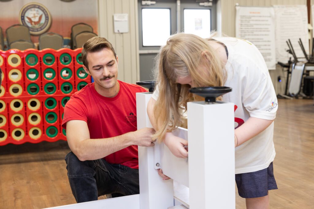 Volunteer Lance Cone helps to assemble a foosball table at Camp Hope in Houston, Texas.