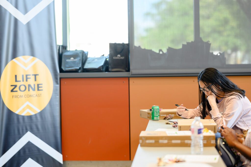 A student writes down tips during the learning session.