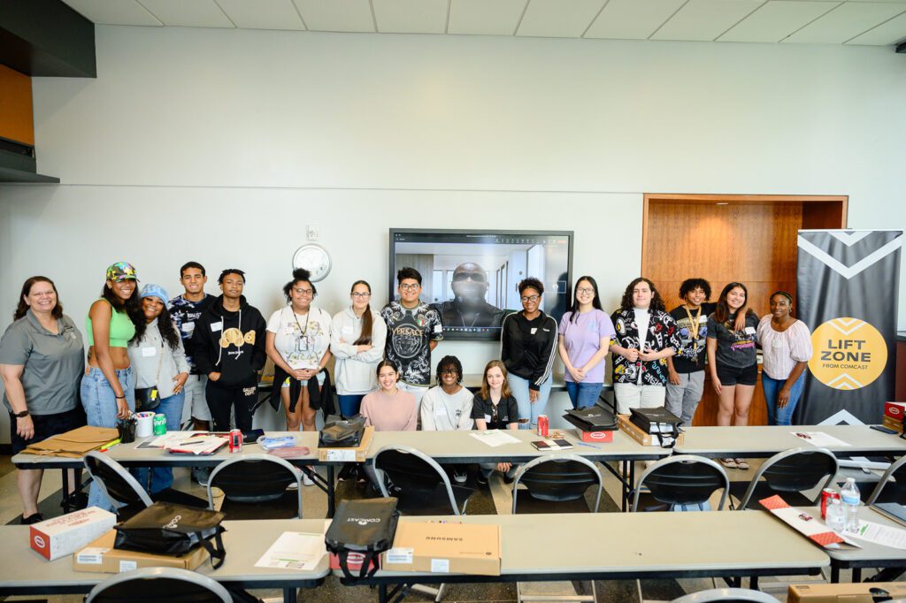 Participants from the learning session smile in a group photo.