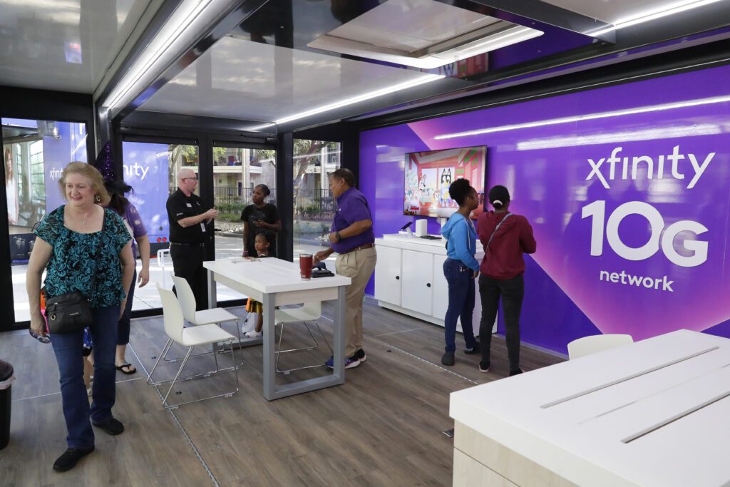 Attendees at the Xfinity booths and displays during the Comcast Kingwood Takeover, held at the Kingwood Town Center Park on Saturday, Oct. 28, 2023 in Kingwood, TX. (Michael Wyke/AP Images for Comcast)